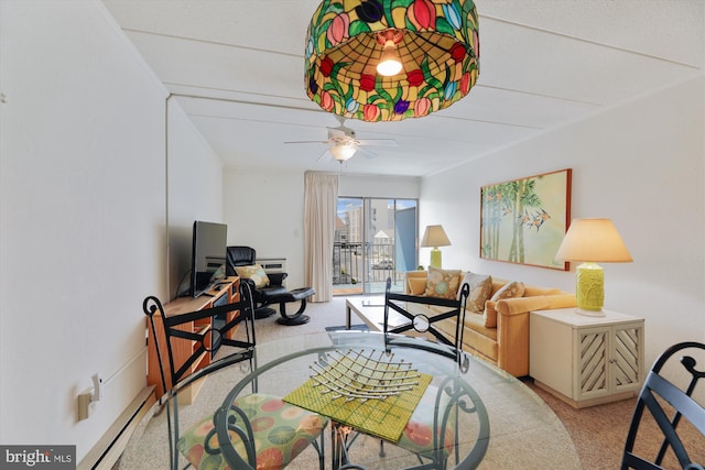 living room with light colored carpet and ceiling fan