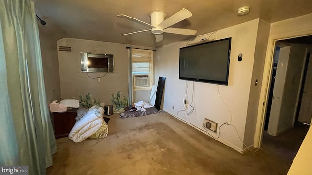 interior space featuring ceiling fan, cooling unit, and carpet