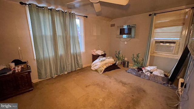 carpeted bedroom with ceiling fan and cooling unit