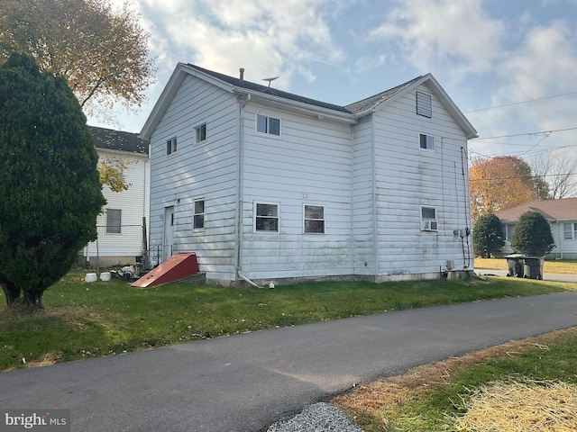 view of property exterior featuring a yard