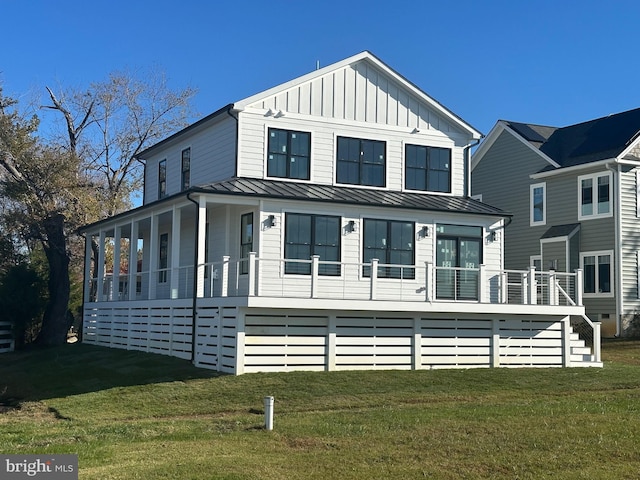 view of front of property with a porch and a front lawn