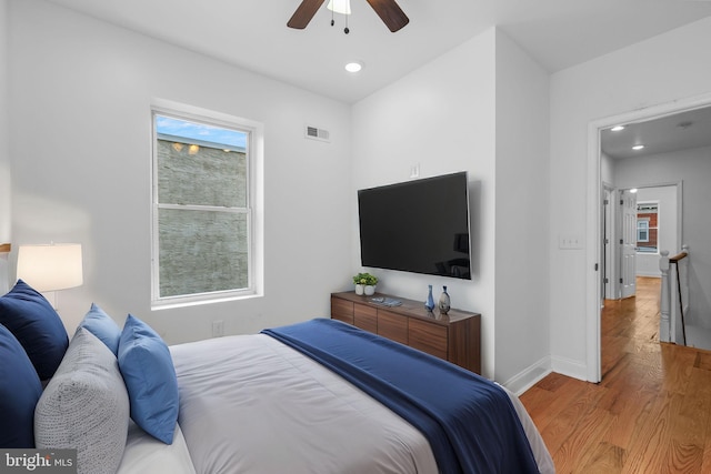 bedroom featuring ceiling fan and light hardwood / wood-style floors