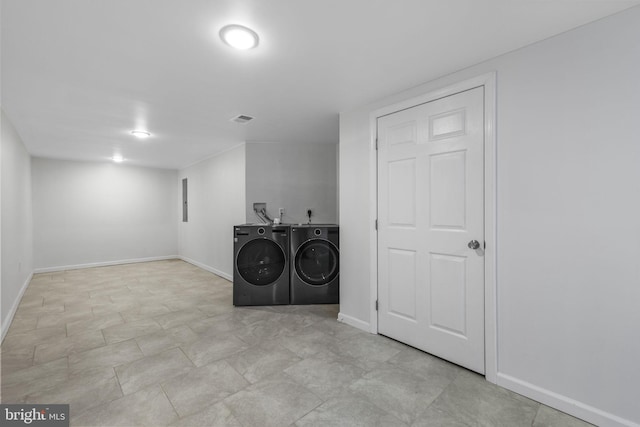 clothes washing area featuring washing machine and clothes dryer