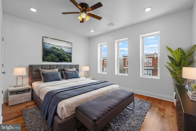 bedroom with light wood-type flooring and ceiling fan