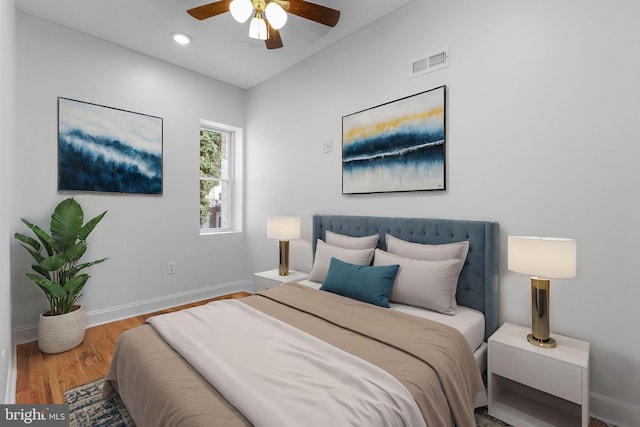 bedroom with ceiling fan and wood-type flooring