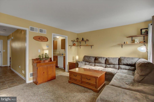 living room featuring light colored carpet and sink