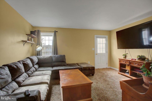 living room featuring carpet flooring and a wealth of natural light