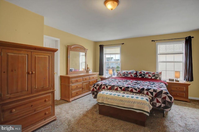 bedroom featuring light colored carpet