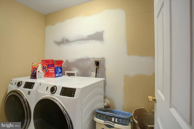 laundry room with separate washer and dryer