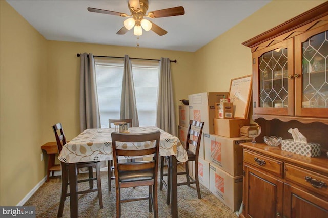 dining room featuring carpet flooring and ceiling fan