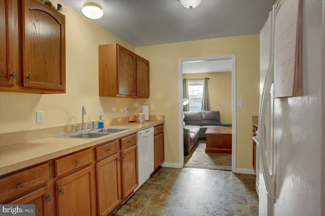 kitchen with sink and white appliances