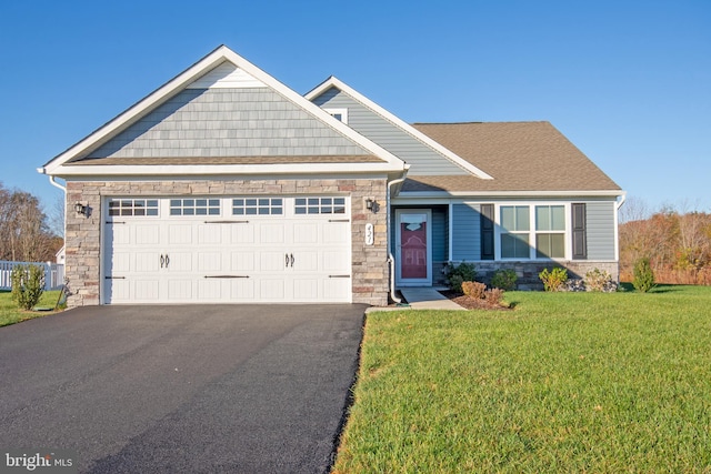 craftsman-style home with a garage and a front yard