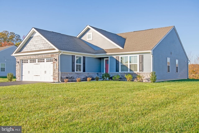 view of front of house featuring a garage and a front yard