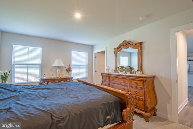 bedroom with light hardwood / wood-style floors