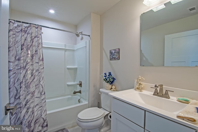 full bathroom with vanity, toilet, and shower / tub combo