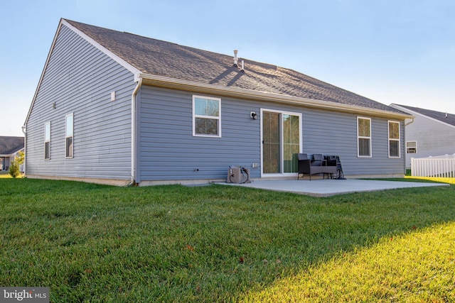 back of house featuring a yard and a patio area