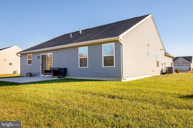 rear view of property with a patio, a lawn, and central air condition unit