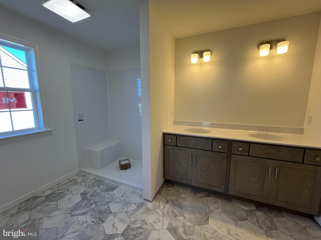 bathroom featuring vanity and a shower