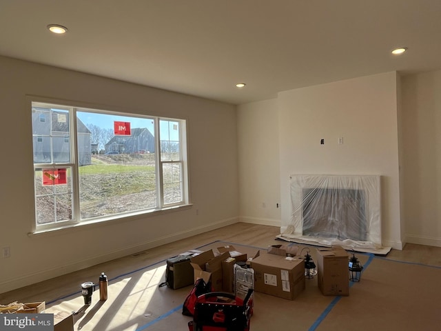 unfurnished living room featuring light wood-type flooring