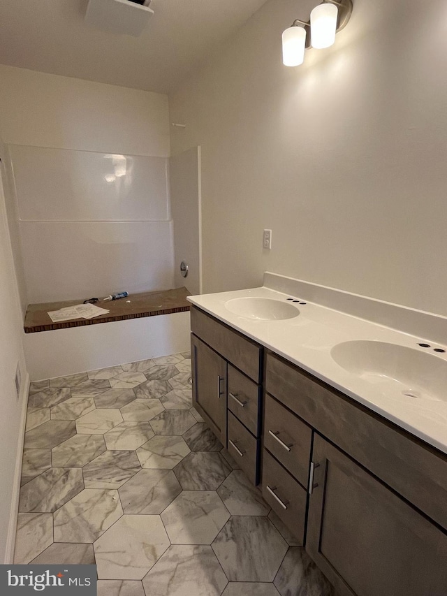 bathroom with vanity and walk in shower