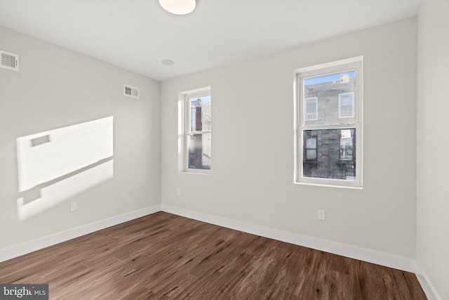 spare room featuring hardwood / wood-style flooring