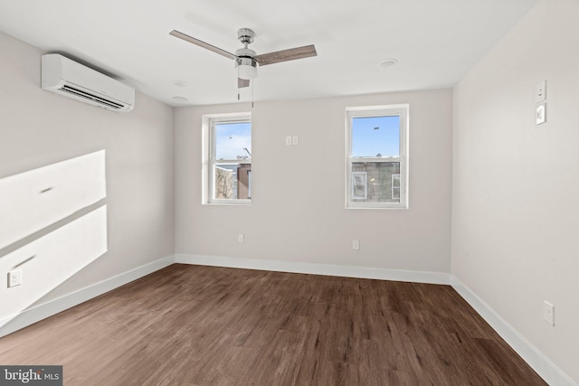 empty room featuring ceiling fan, dark hardwood / wood-style floors, and a wall mounted air conditioner