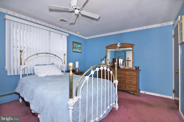 bedroom featuring dark colored carpet, baseboard heating, and ceiling fan