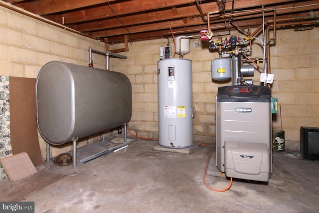 utility room featuring water heater