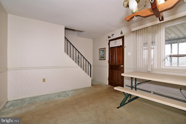 foyer entrance featuring carpet