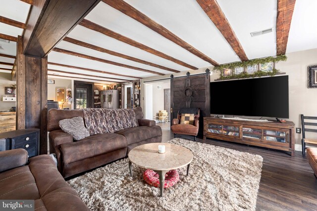 3204 State Route 72, Jonestown, PA 17038 - living area featuring a barn door, dark wood-style floors, and beamed ceiling