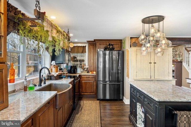 3204 State Route 72, Jonestown, PA 17038 - kitchen featuring freestanding refrigerator, electric range, brown cabinetry, dark wood-type flooring, and light stone countertops