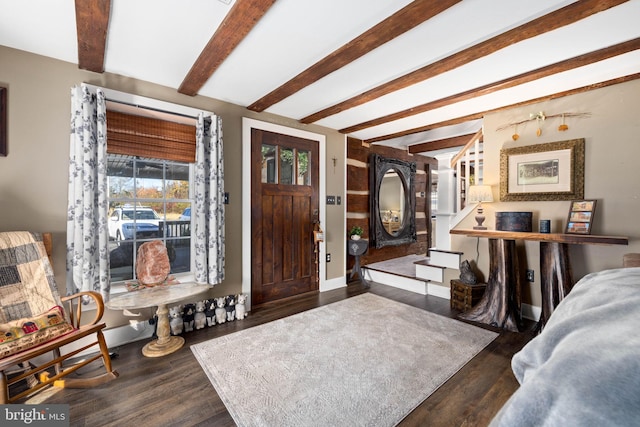 foyer entrance featuring dark hardwood / wood-style flooring and beam ceiling