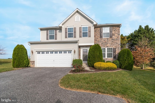 front of property featuring a garage and a front yard