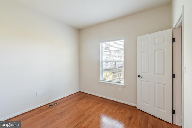 unfurnished room with light hardwood / wood-style floors