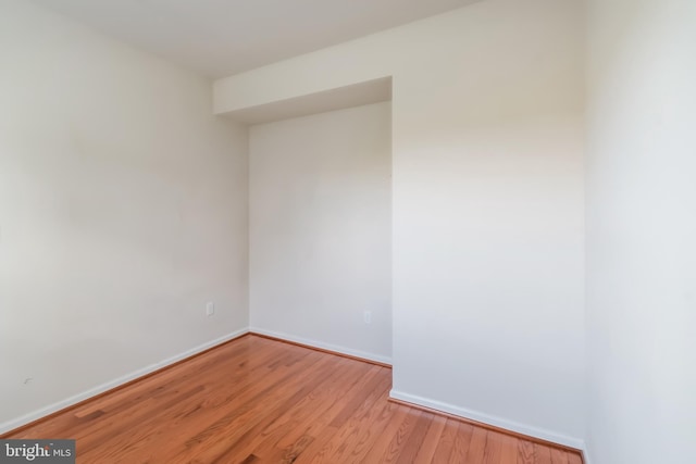 unfurnished room with light hardwood / wood-style floors