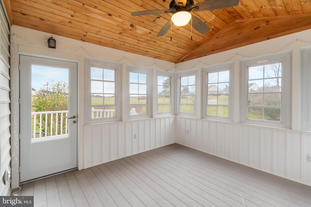 unfurnished sunroom featuring a wealth of natural light, vaulted ceiling, ceiling fan, and wood ceiling