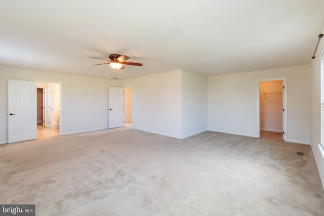 empty room with light carpet and ceiling fan