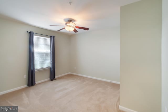 carpeted empty room with ceiling fan