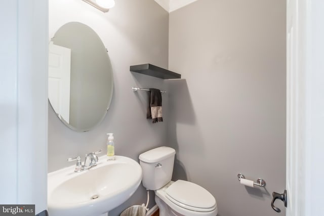 bathroom featuring sink and toilet