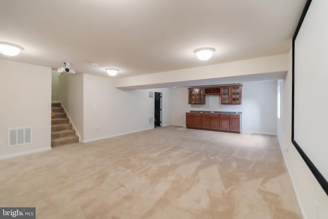 basement with light colored carpet