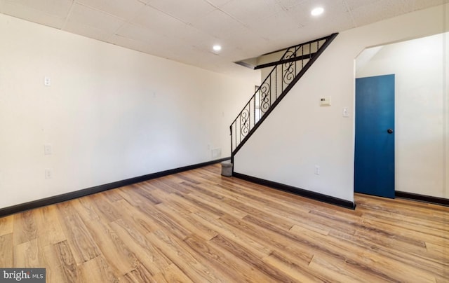 unfurnished room with light wood-type flooring