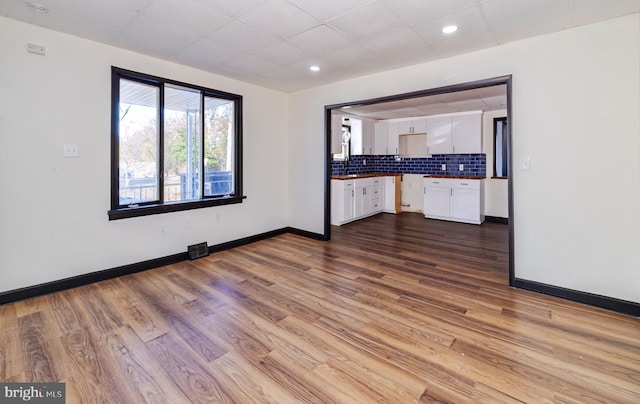 interior space featuring hardwood / wood-style flooring and sink