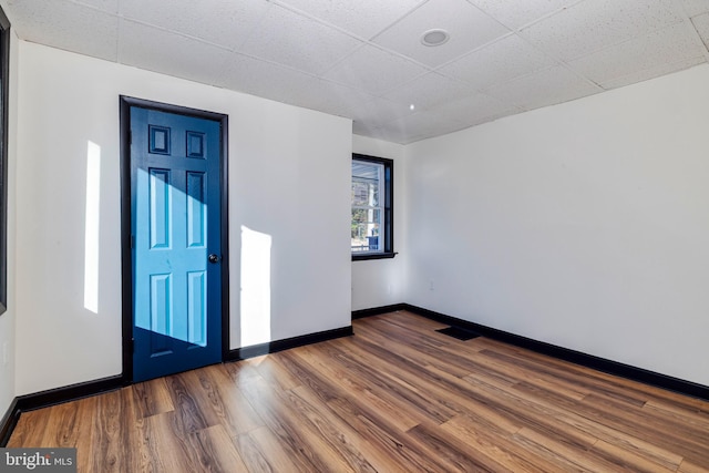 entryway with a paneled ceiling and hardwood / wood-style flooring