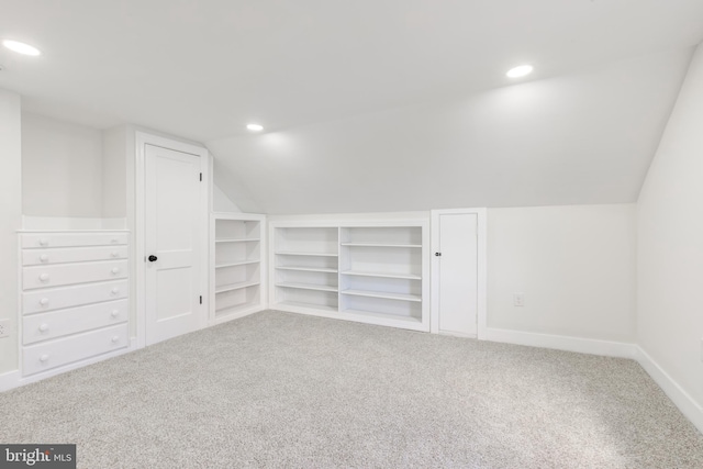 bonus room featuring carpet and lofted ceiling