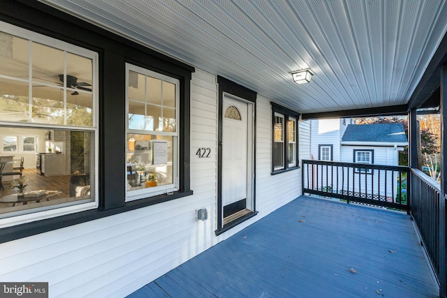 wooden terrace with a porch