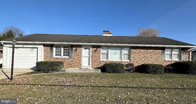 ranch-style home with a garage and a front yard