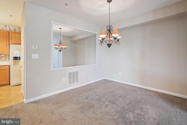 interior space with a notable chandelier and light carpet