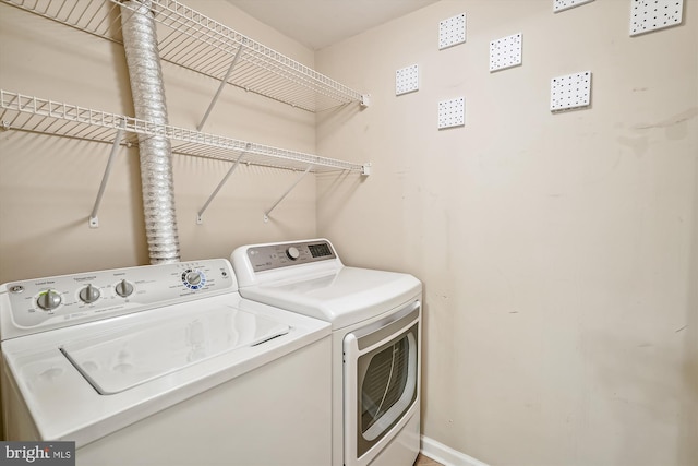 clothes washing area featuring washing machine and clothes dryer