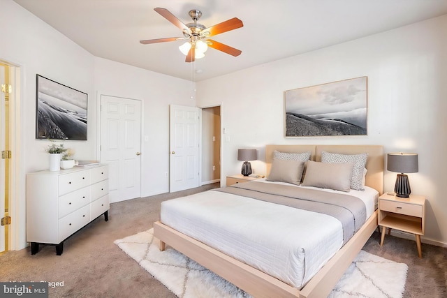 carpeted bedroom featuring ceiling fan