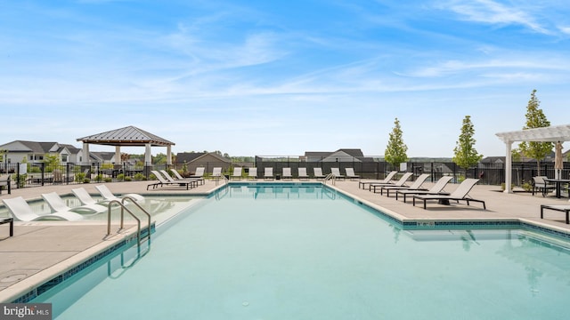 view of swimming pool with a patio area and a gazebo